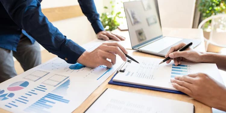 Investigators analyzing financial documents